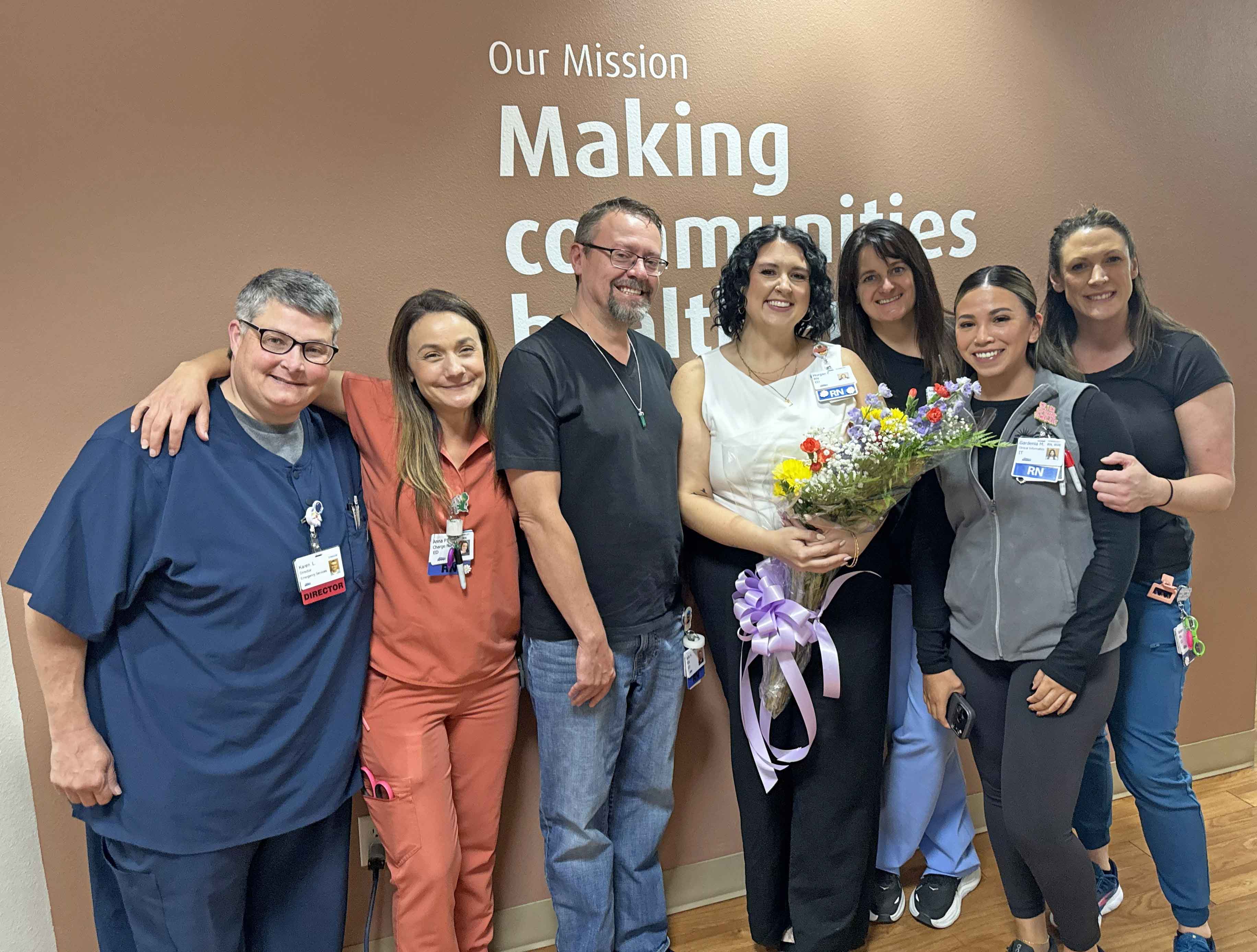 Staff members from the Emergency Department celebrate Morgan's win.