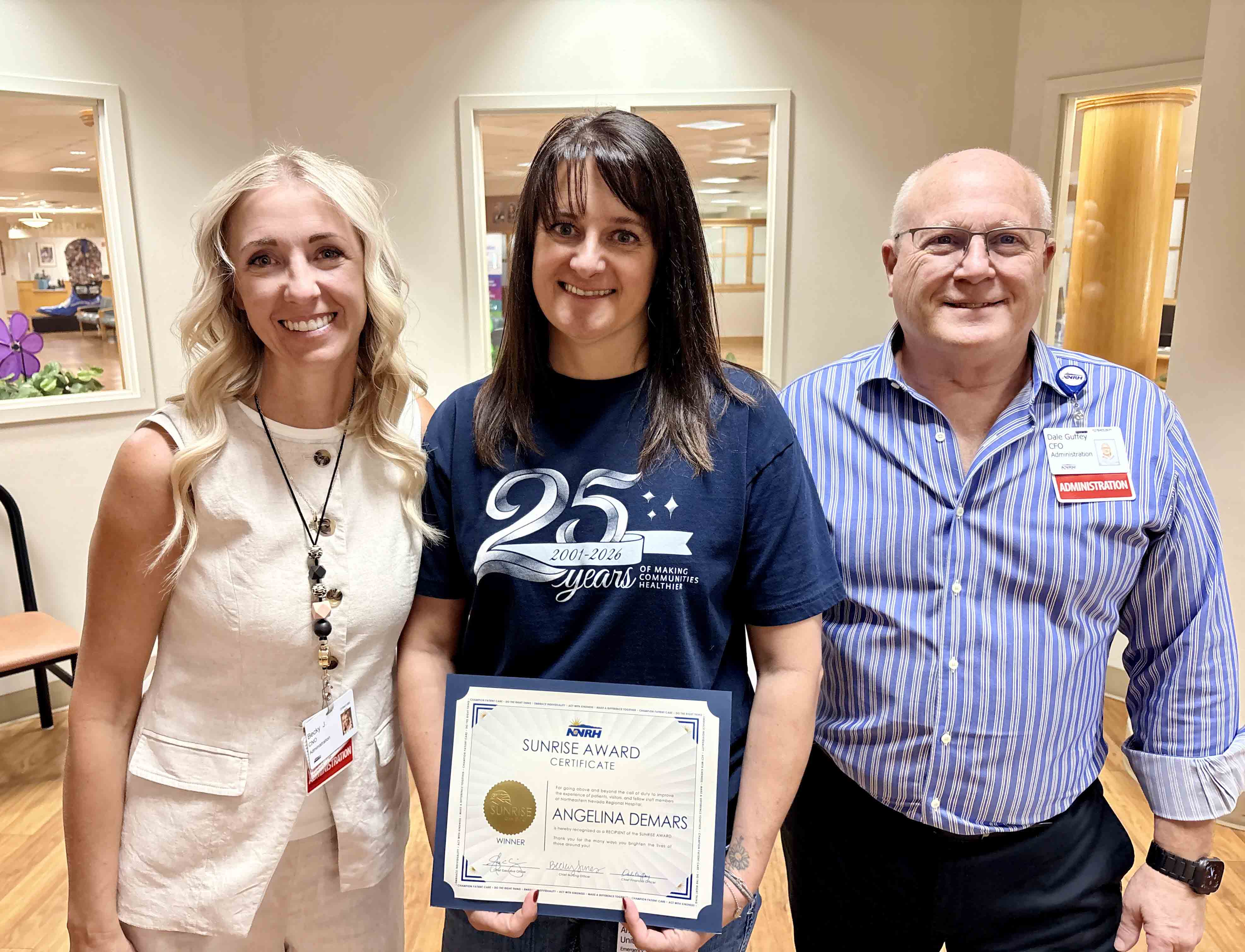 Angelina DeMars wins the Sunrise Award Angelina DeMars poses with the Chief Nursing Officer and Chief Financial Officer at NNRH
