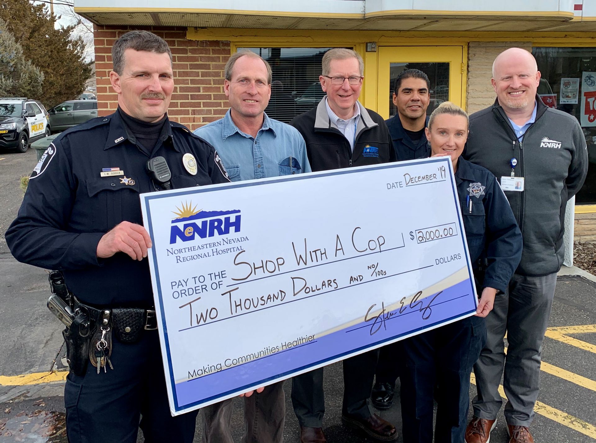 Pictured from left: Officer Christopher Gevock of the Elko Police Department; Jimmy Stewart, program director of Shop With A Cop; Greg Hexem, chief financial officer of NNRH; Trooper Jorge Hernandez and Trooper Natalie Hernandez of the Nevada Highway Patrol; and Steve Simpson, chief executive officer of NNRH.
